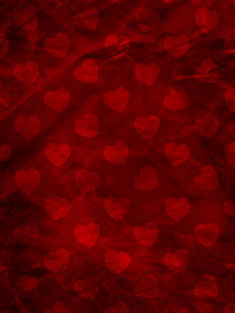 Free photo grunge old crumpled paper background texture with valentines day hearts design
