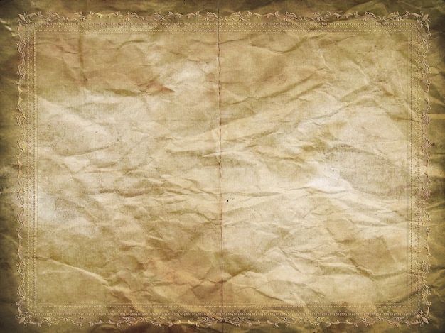 Free photo grunge paper background with a decorative embossed border