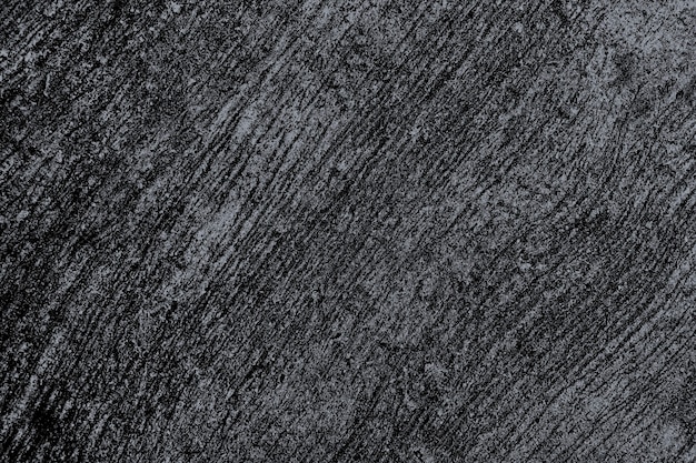 Grunge scratched black concrete textured background