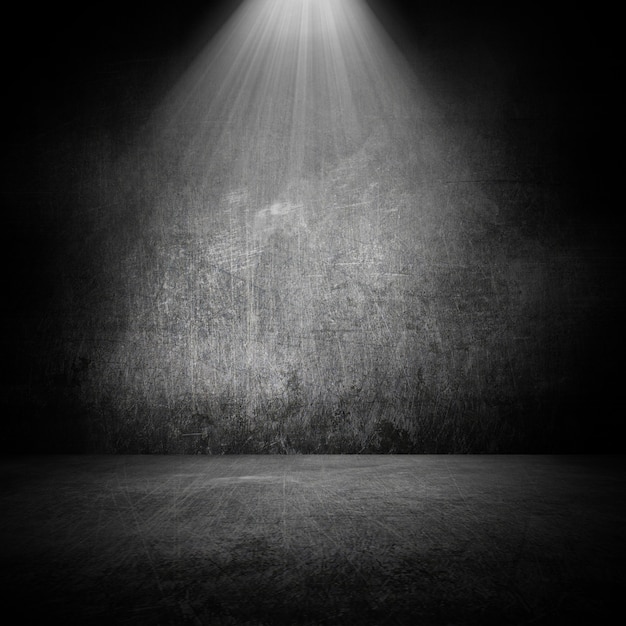 Free photo grunge style room interior with spotlight shining down