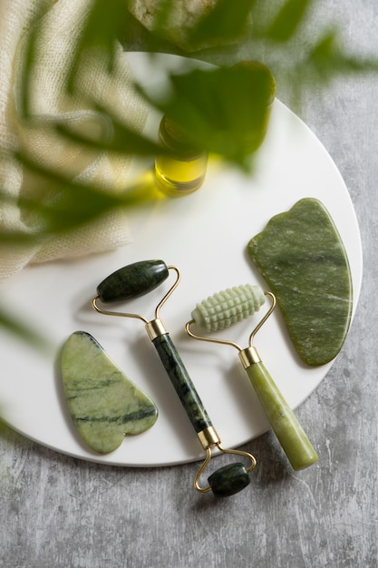 Free photo gua sha and face rollers arrangement flat lay