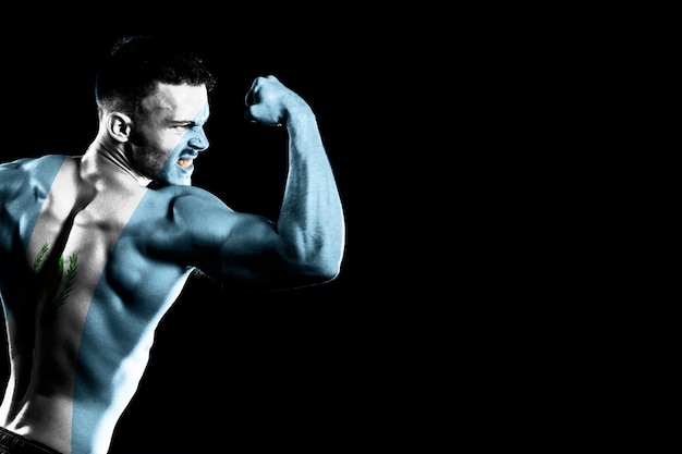 Guatemala flag on handsome young muscular man black background