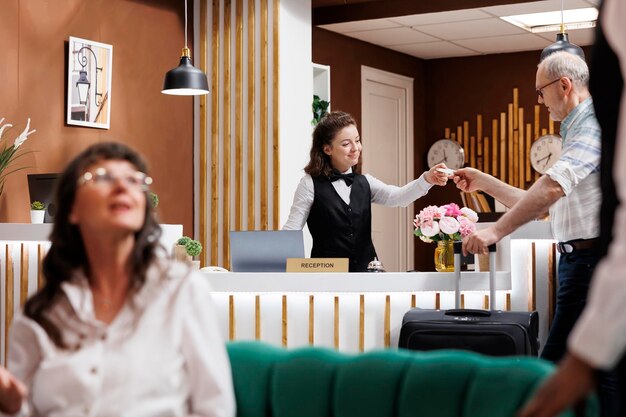 Guests checking in at hotel lounge area