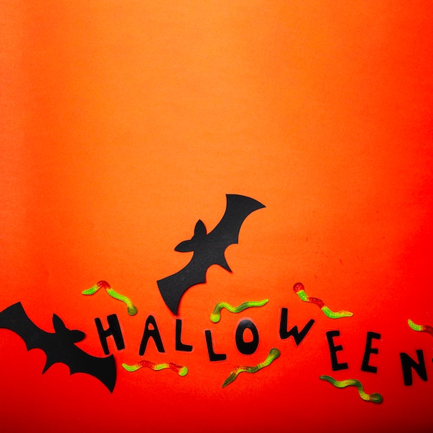 Gummy worms and decorative Halloween bats