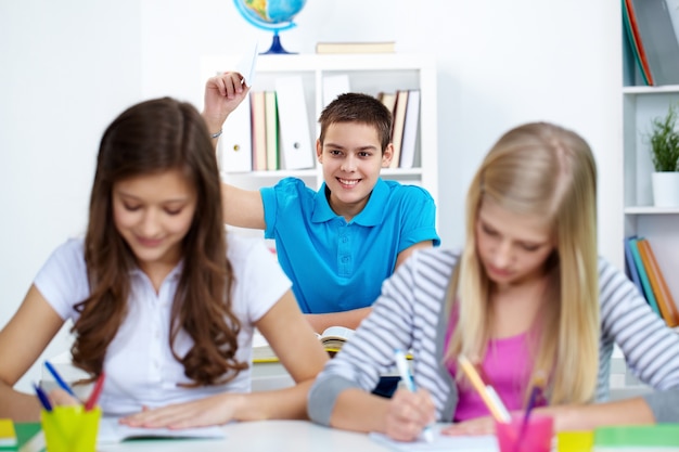 Guy disturbing his classmates