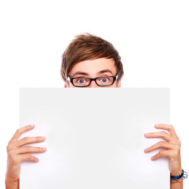 Guy in glasses holding blank board