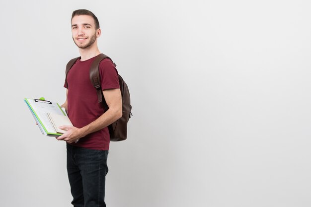 Guy holding a folder with notes