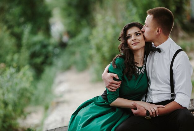 Guy kissing his girlfriend's forehead