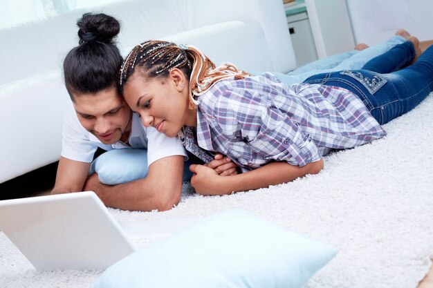 Guy lying on the floor with his girlfriend