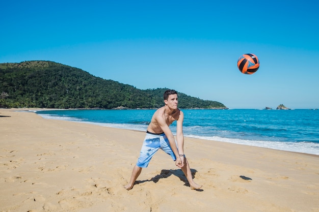 Guy receiving volleyball