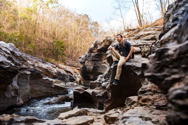 Guy sitting at river