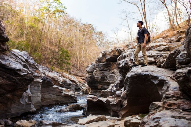 Guy standing near river