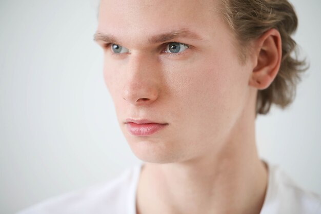 Guy with blond hair and white shirt