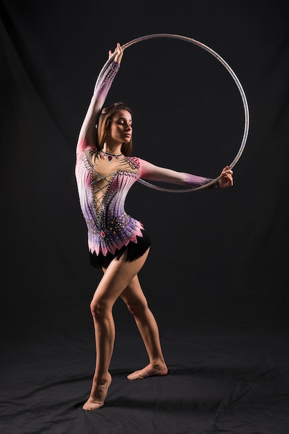 Free photo gymnast using the hoop