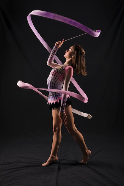 Free photo gymnast using the ribbon