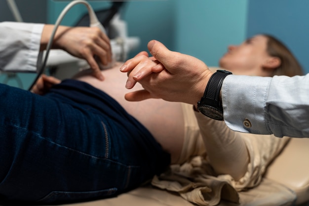 Gynecologist performing ultrasound consultation