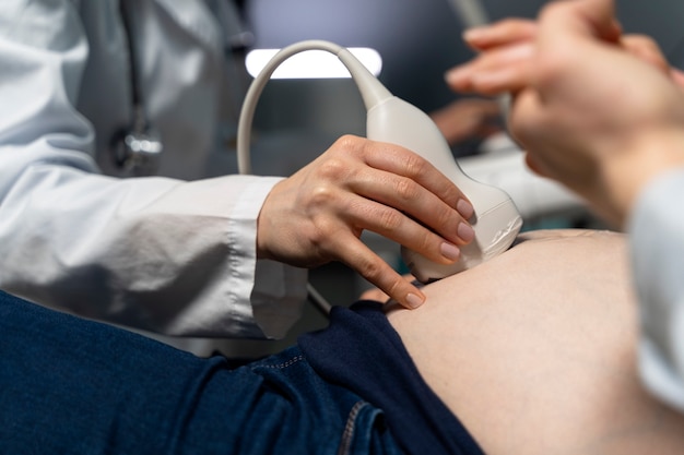 Gynecologist performing ultrasound consultation