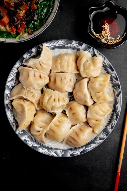  gyoza with soy sauce on a plate