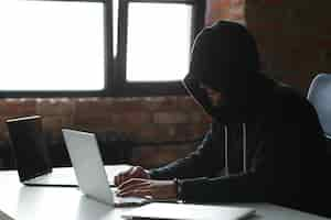 Free photo hacker man on laptop