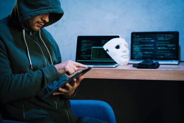 Hacker using tablet