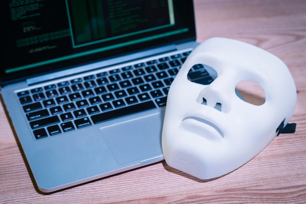 Hackers mask and laptop