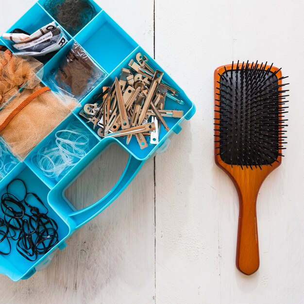 Hair brush and box with hairdressing supplies