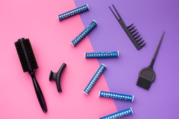 Hair curlers and brushes flat lay