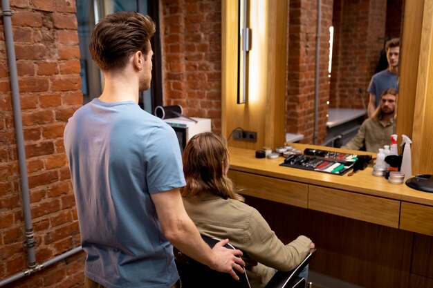 Hairdresser grooming their client