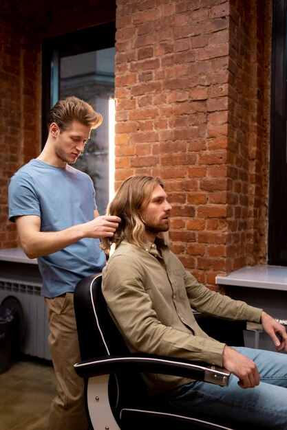 Hairdresser grooming their client