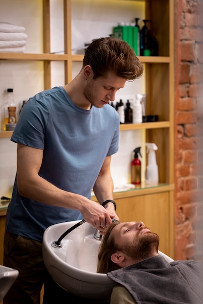 Hairdresser grooming their client