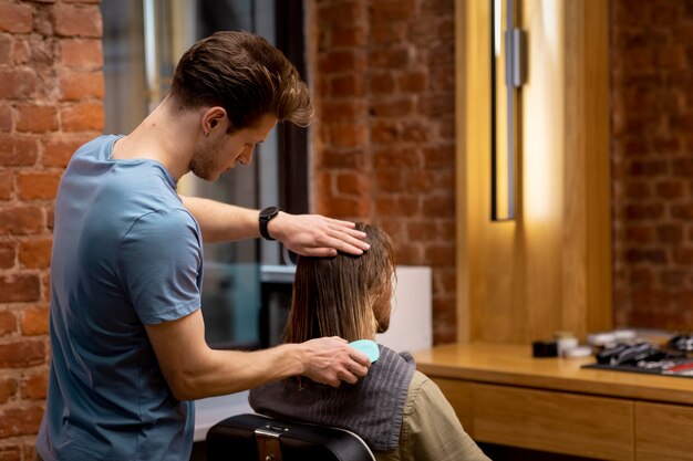 Hairdresser grooming their client