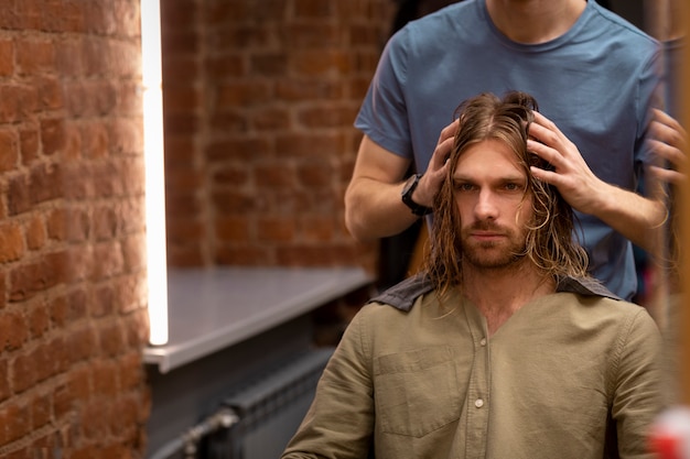 Hairdresser grooming their client