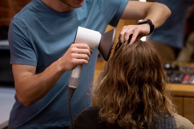 Hairdresser grooming their client