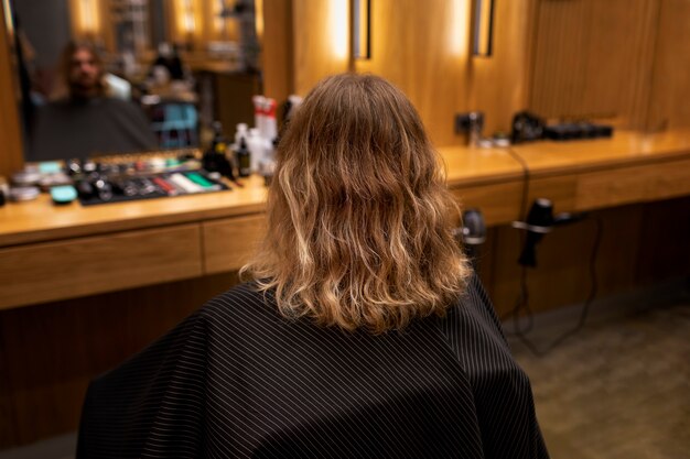 Hairdresser grooming their client