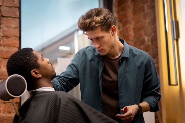 Free photo hairdresser grooming their client