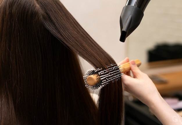 Hairdresser styling a client's hair