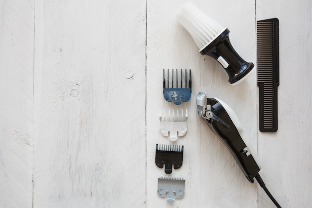 Hairdressing razor near brush and comb