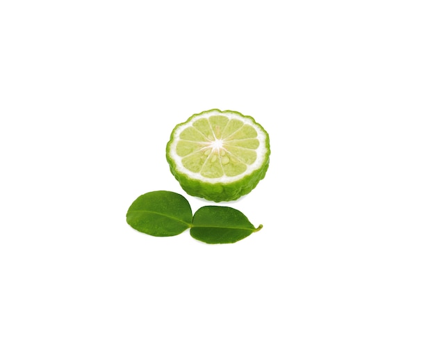 A half of bergamot fruit with green leaf isolated on white
