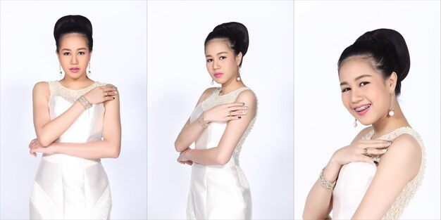 20대의 아름다운 날씬한 건강한 아시아 여성의 반신 초상화는 실크 이브닝 가운, 검은 머리 교정기 치아 리테이너를 착용합니다. 젊은 여성 표현 스튜디오 흰색 배경에 고립 된 행복 한 미소 느낌