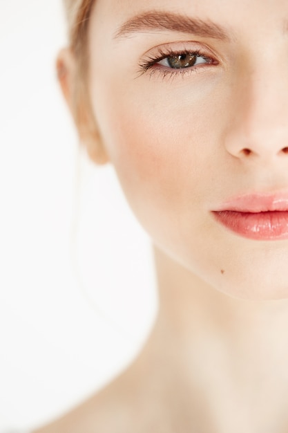 Half face portrait of young beautiful girl with clean fresh skin . Beauty and health lifestyle.