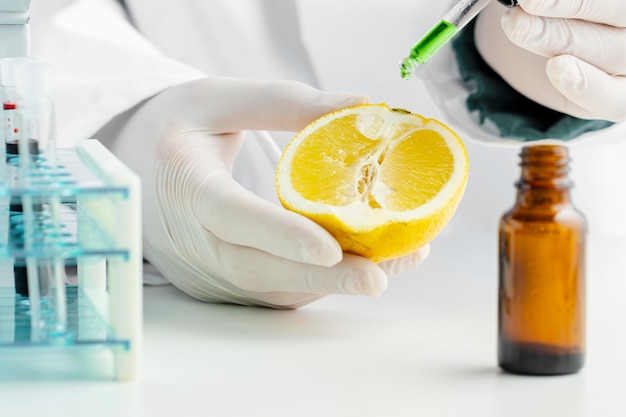 Half of lemon and green chemicals