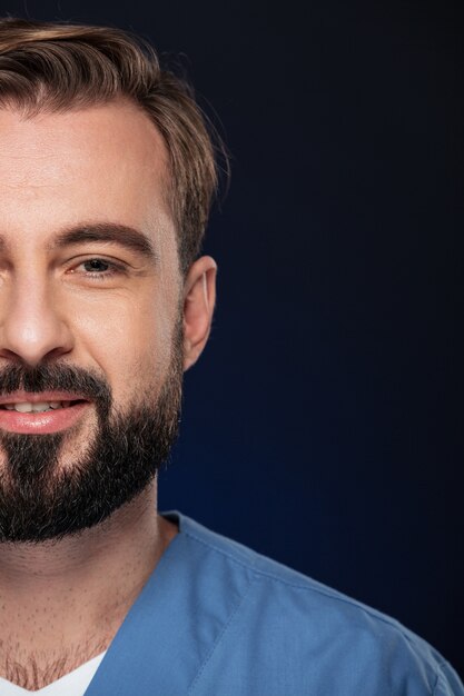 Half lose up portrait of a smiling male doctor