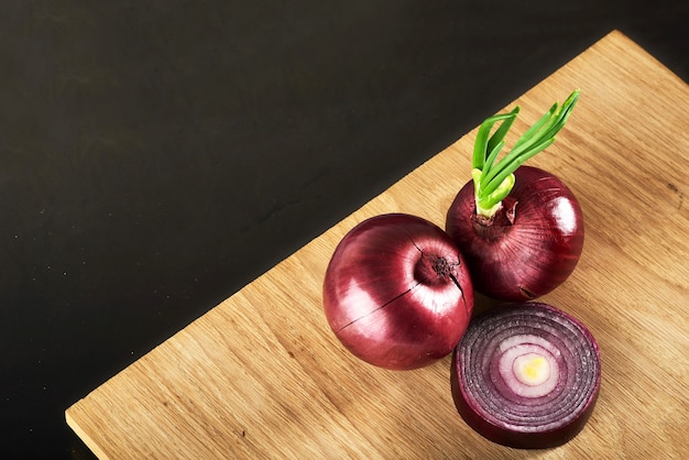 Half red onion on a wooden.