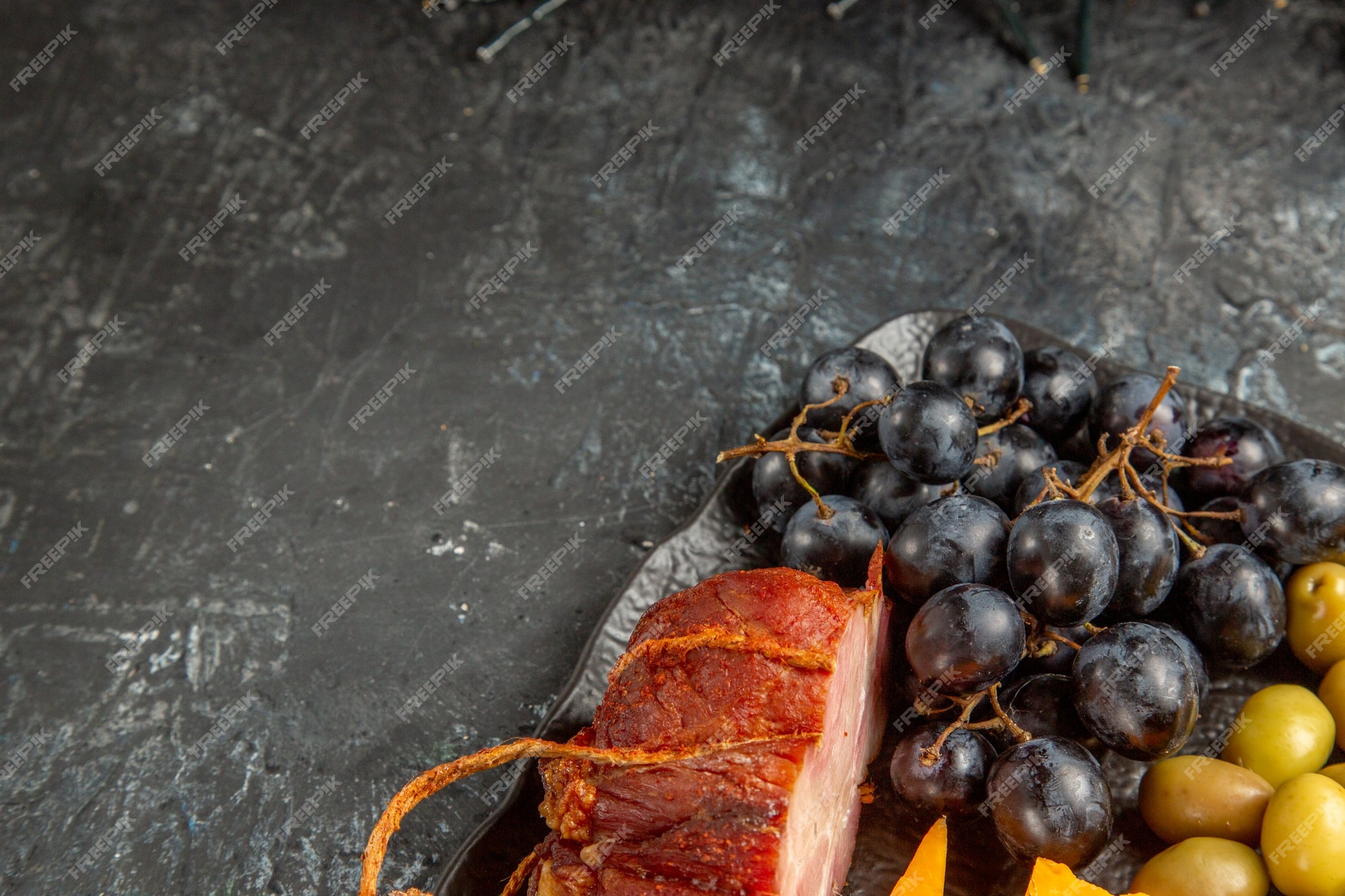 Free Photo | Half shot of delicious best snack for wine served on brown  tray on gray background