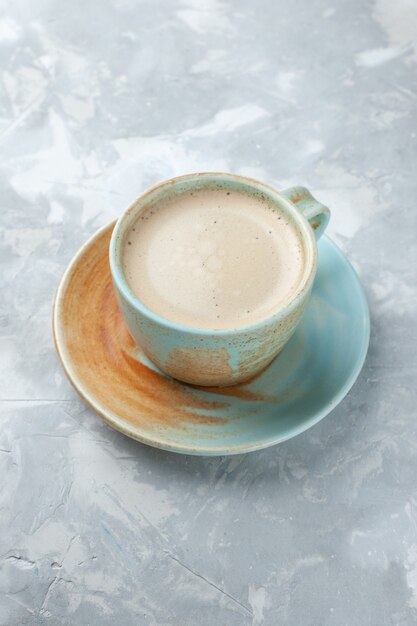 Half-top view cup of coffee with milk inside cup on the white desk drink coffee milk desk color