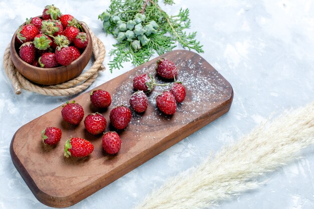 Half-top view fresh red strawberries mellow berries on light desk berry fruit vitamine wild forest vitamine summer