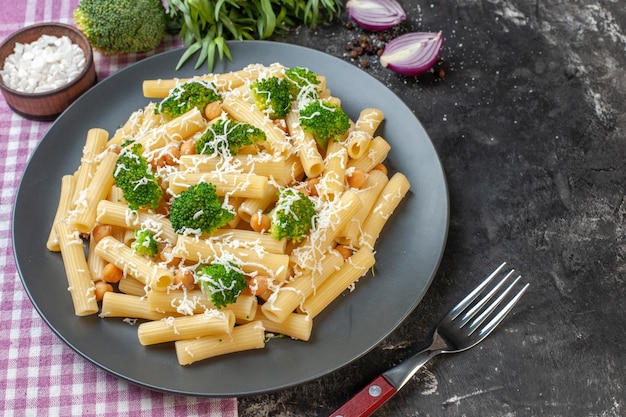 Half-top view tasty cooked pasta with broccoli on light background color photo green food italy meal pepper dough