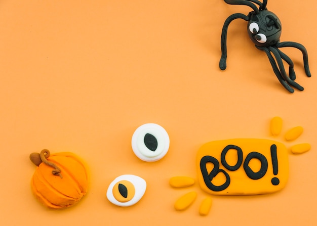 Halloween arrangement with plasticine spider and eyes