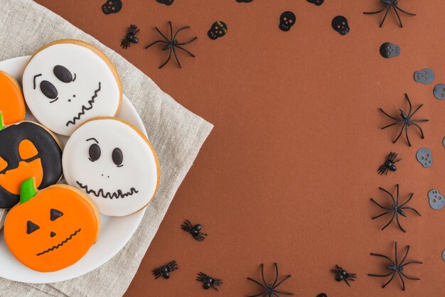 Halloween cakes on plate placed on linen tablecloth