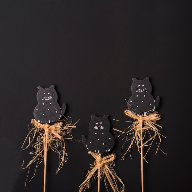 Free photo halloween cats on sticks